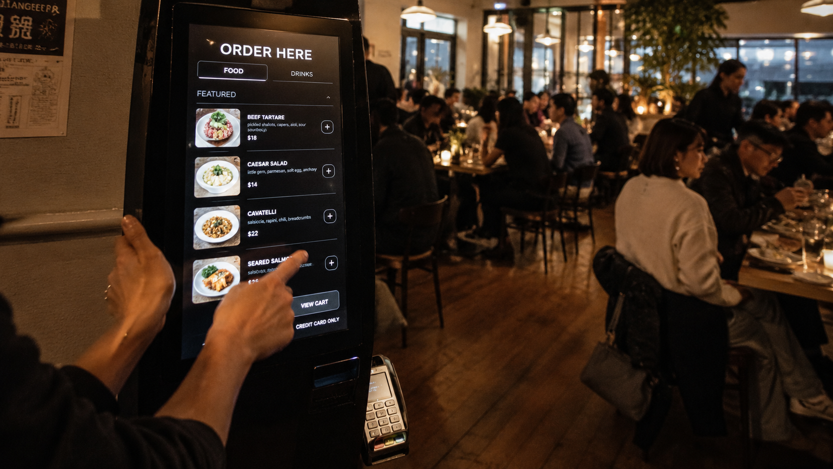 Customer ordering at a restaurant kiosk